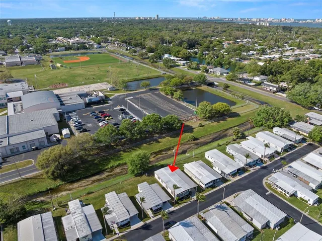 an aerial view of a houses with a lake view