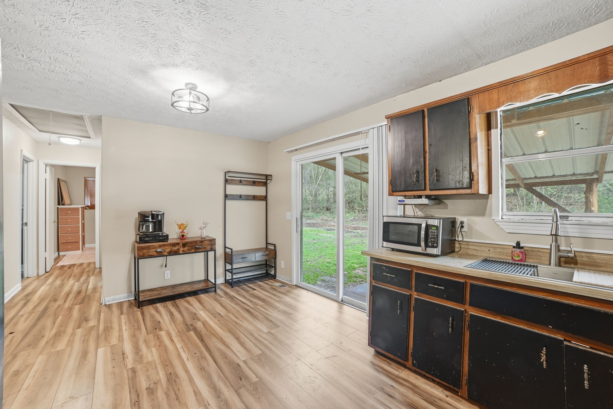428 Scarborough Hollow Road Stewart, TN 37175 - Photo 17 of 28 a kitchen with kitchen island granite countertop a sink appliances cabinets and furniture