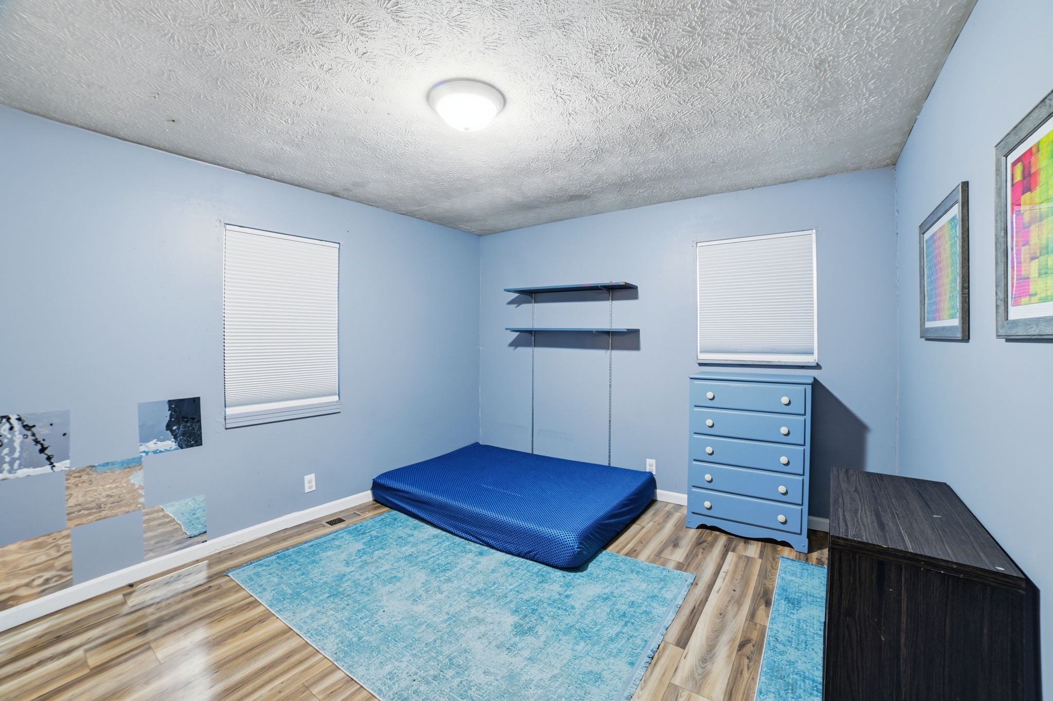 428 Scarborough Hollow Road Stewart, TN 37175 - Photo 23 of 28 a view of a bedroom with furniture and wooden floor