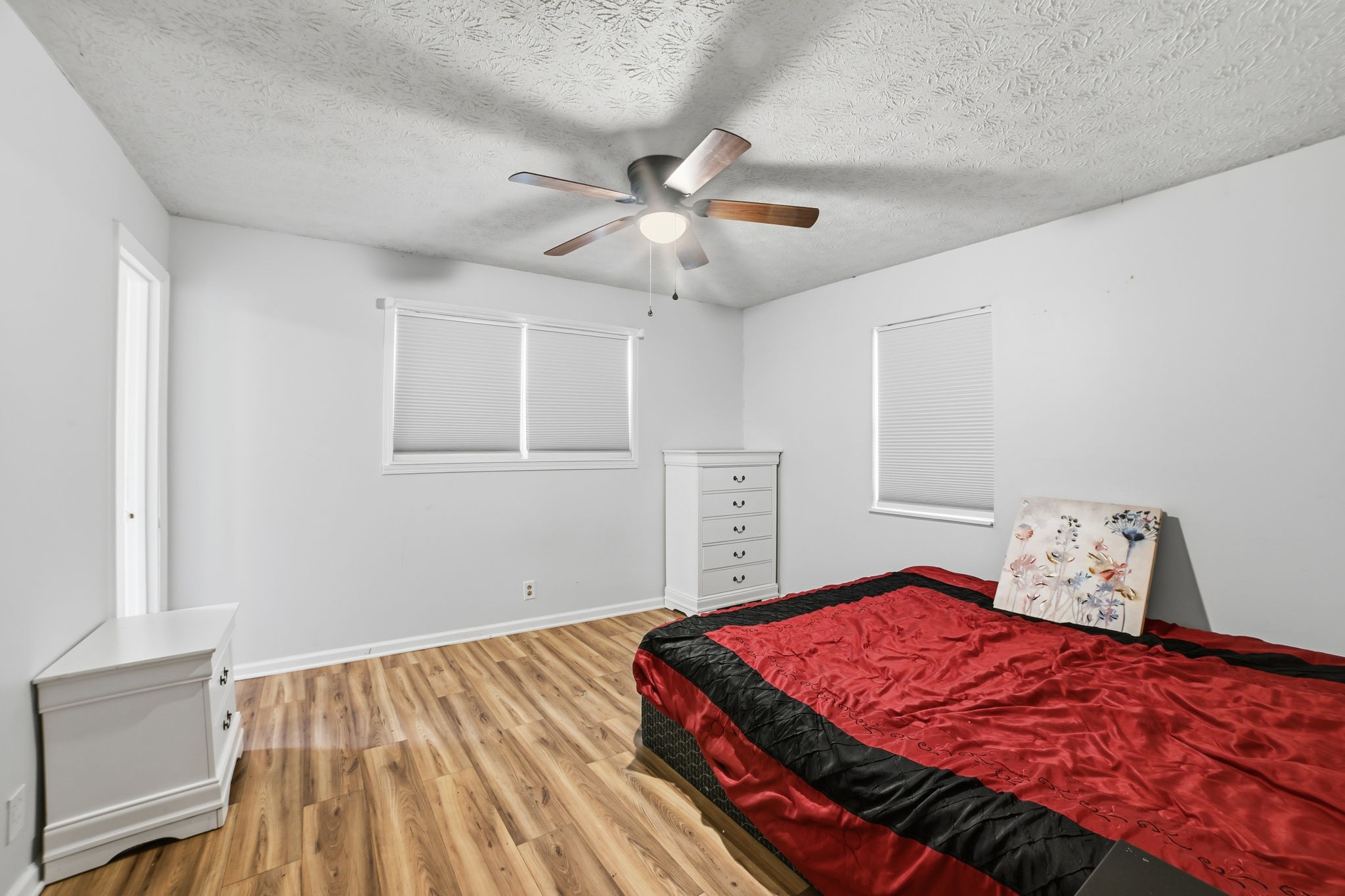 428 Scarborough Hollow Road Stewart, TN 37175 - Photo 26 of 28 a bedroom with a bed and a chandelier