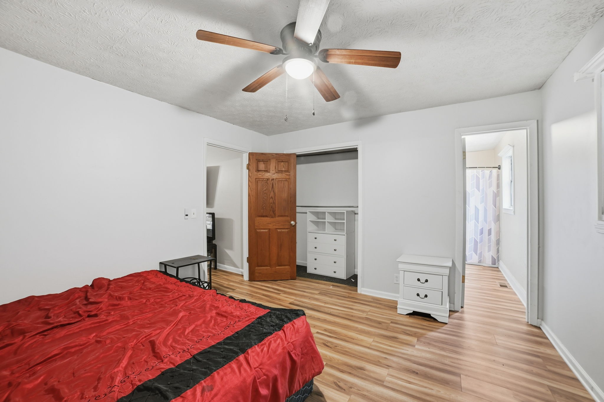 428 Scarborough Hollow Road Stewart, TN 37175 - Photo 27 of 28 a bedroom with a bed and a chandelier