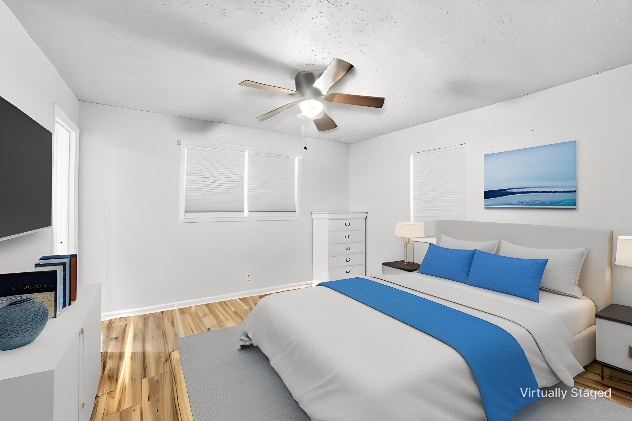 428 Scarborough Hollow Road Stewart, TN 37175 - Photo 3 of 28 a bedroom with a large bed and a flat tv screen on dresser