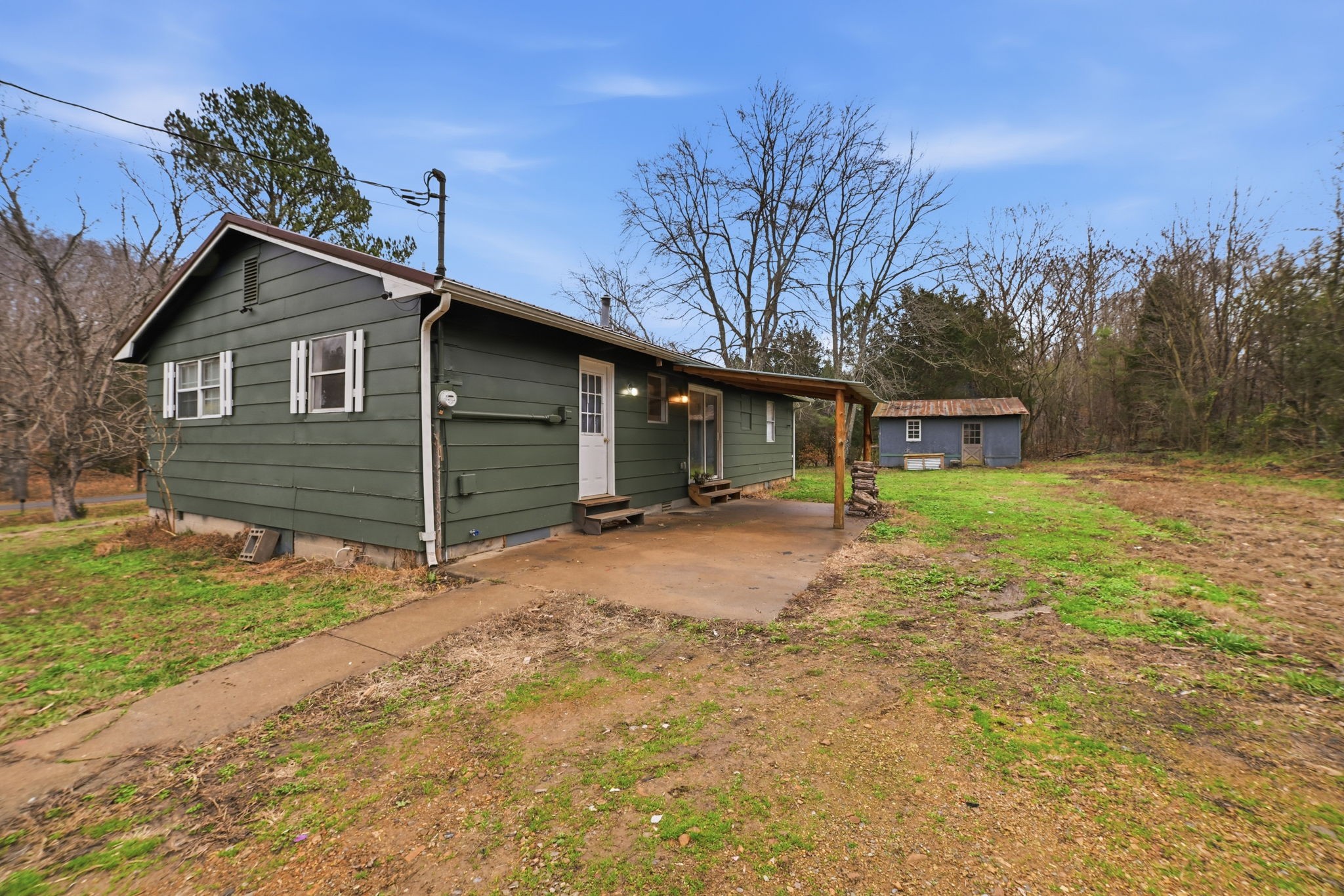 428 Scarborough Hollow Road Stewart, TN 37175 - Photo 9 of 28 a front view of a house with a yard and garage