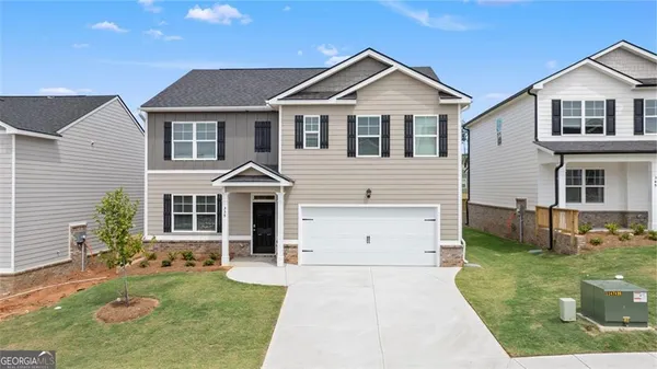 front view of a house with a yard