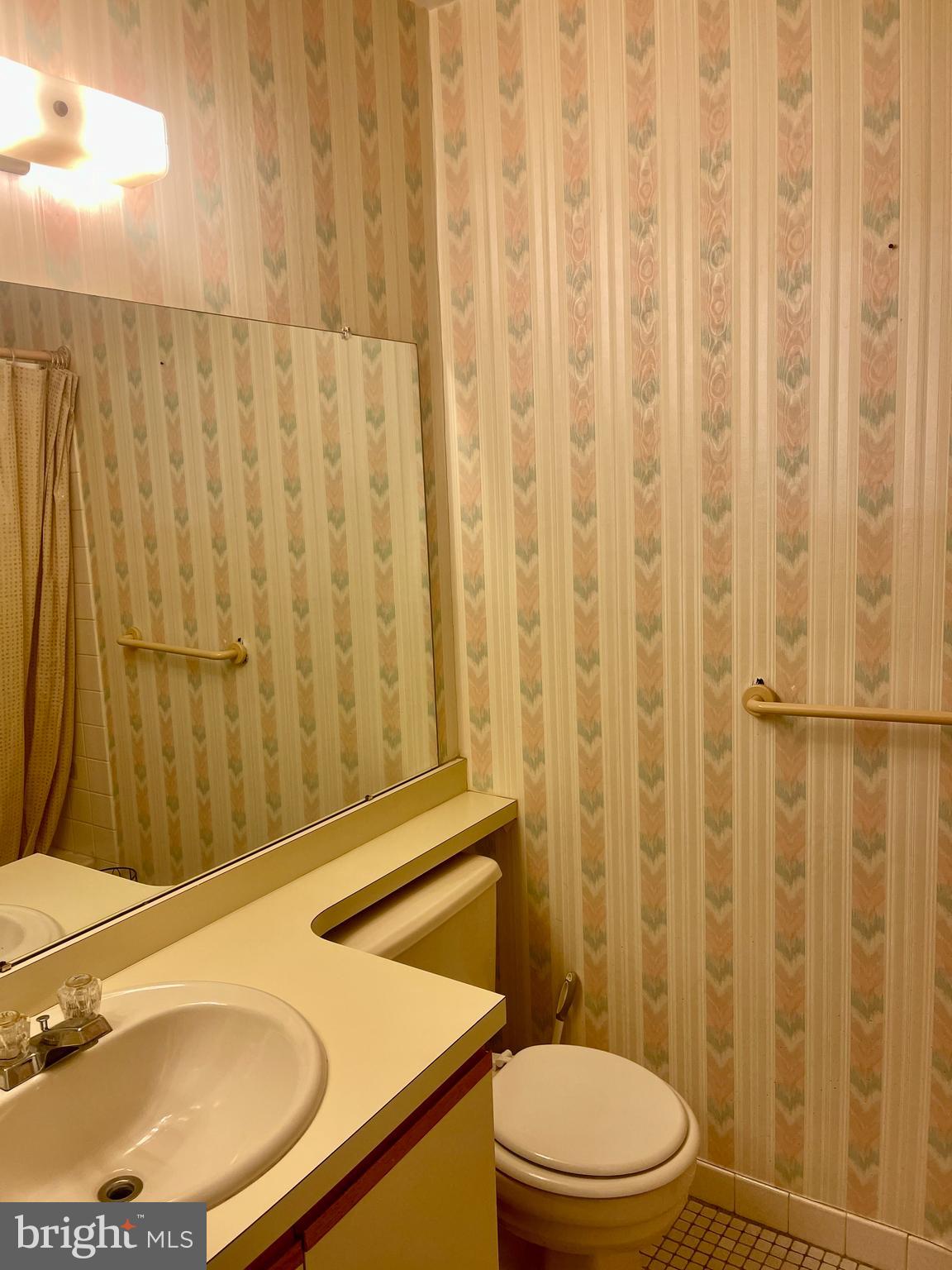 60201 Delaire Landing Road, Unit 201 Philadelphia, PA 19114 - Photo 19 of 49 a bathroom with a sink toilet and shower