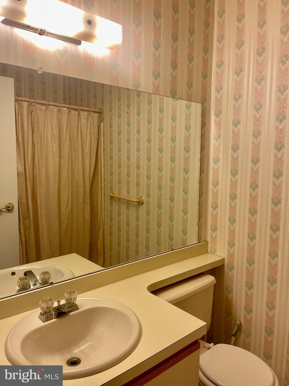 60201 Delaire Landing Road, Unit 201 Philadelphia, PA 19114 - Photo 21 of 49 a bathroom with a sink and a mirror