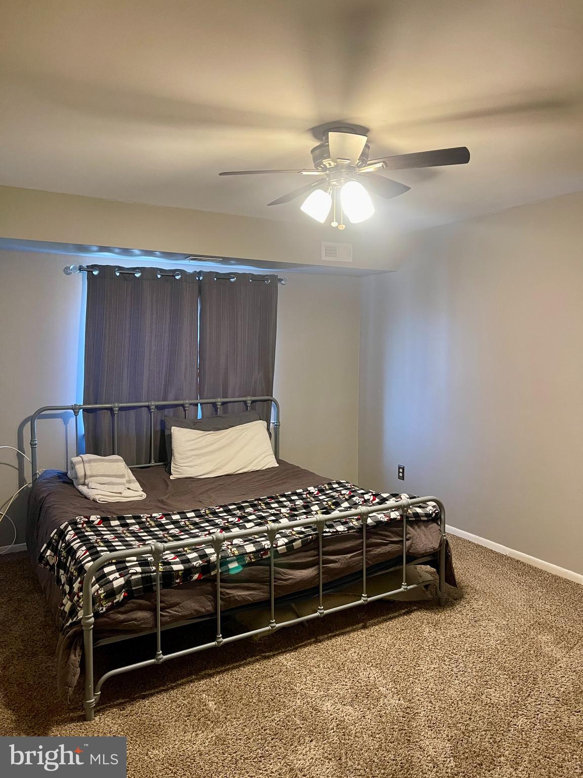 60201 Delaire Landing Road, Unit 201 Philadelphia, PA 19114 - Photo 25 of 49 a bedroom with a bed and a chandelier