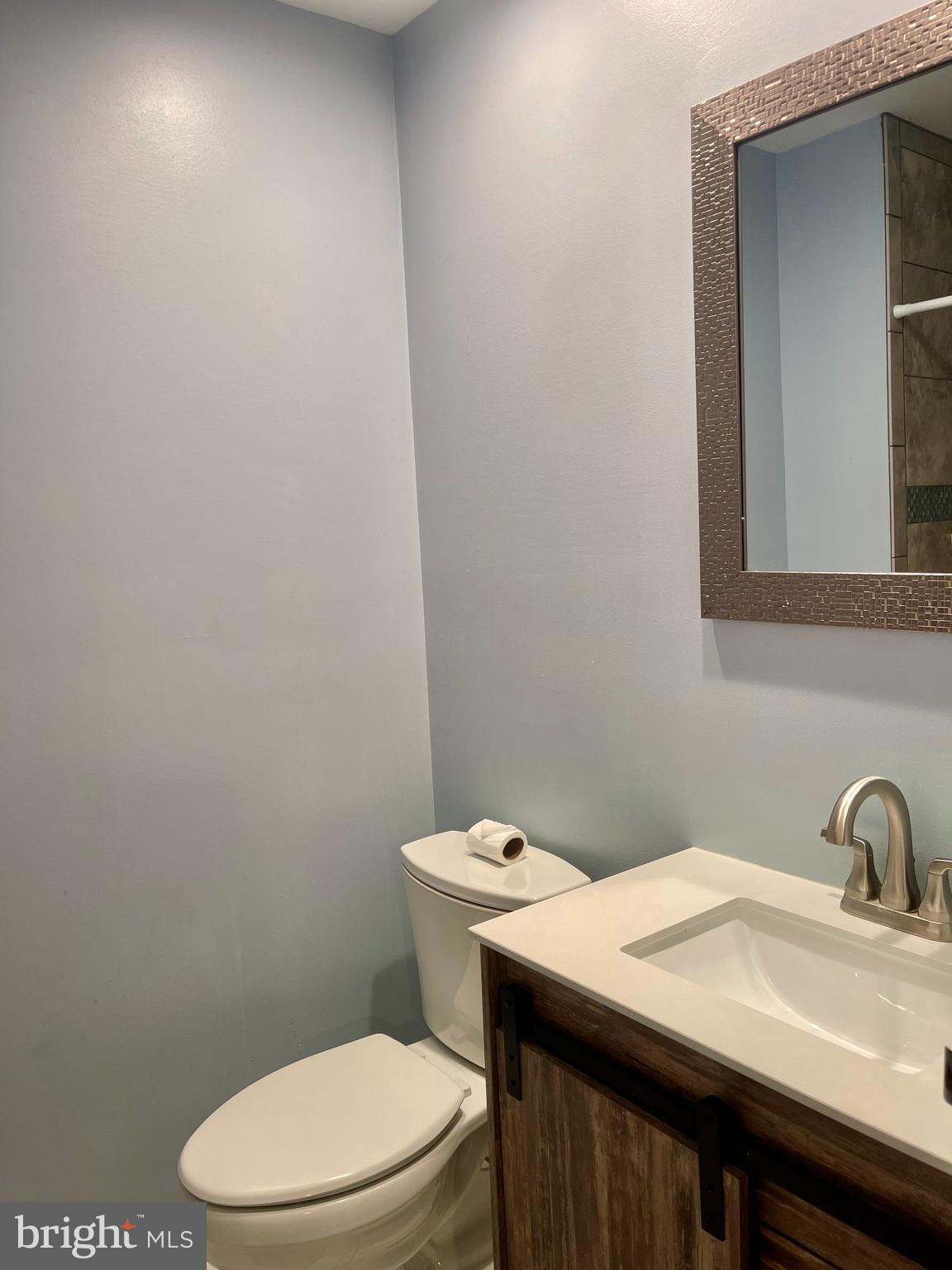 60201 Delaire Landing Road, Unit 201 Philadelphia, PA 19114 - Photo 29 of 49 a bathroom with a sink a toilet