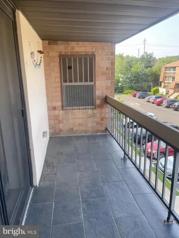 a view of porch with wooden floor and furniture
