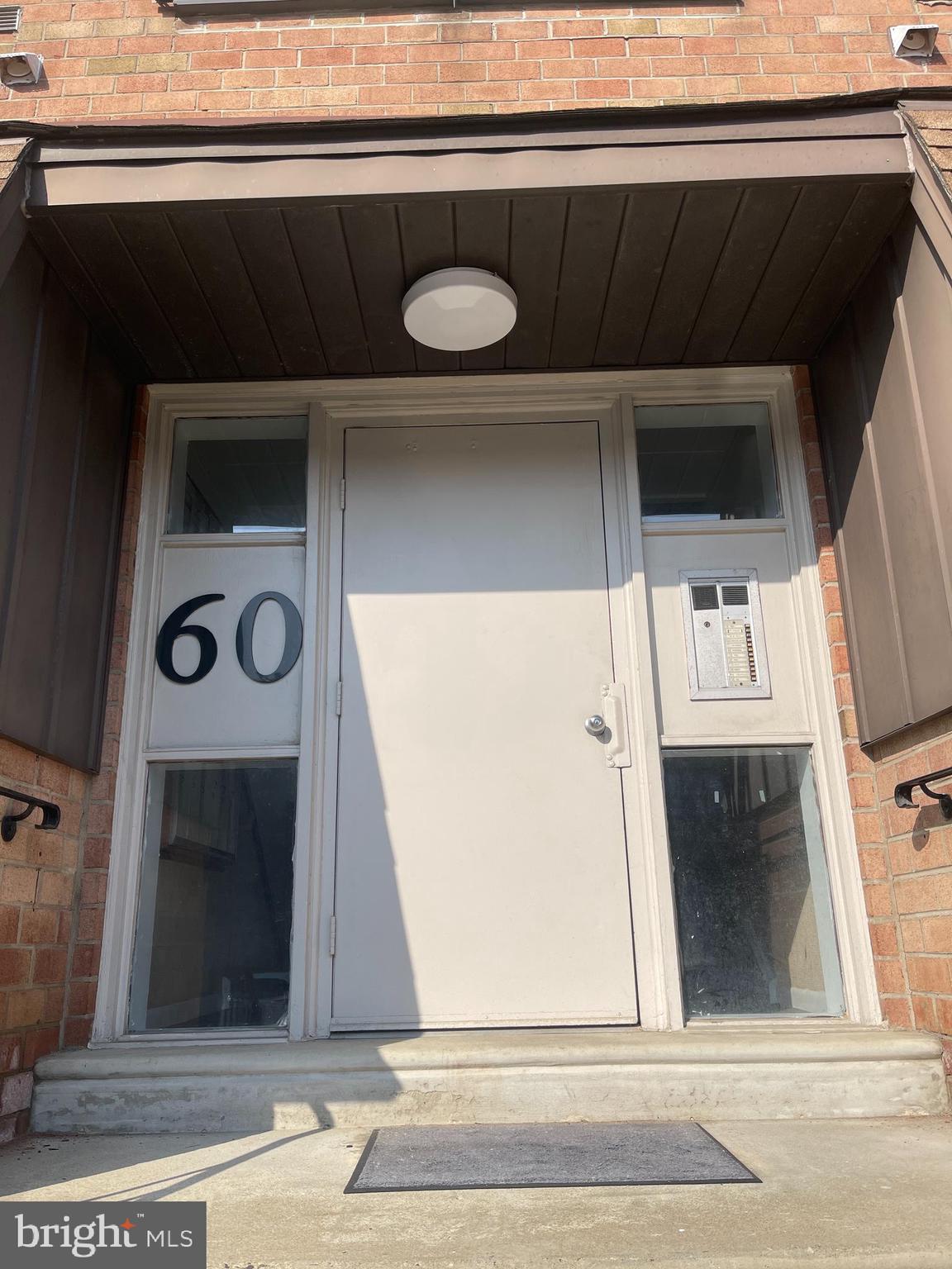 60201 Delaire Landing Road, Unit 201 Philadelphia, PA 19114 - Photo 4 of 49 a view of a hallway with wooden floor and staircase
