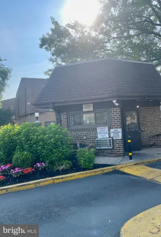 a view of a house with a yard and a garden