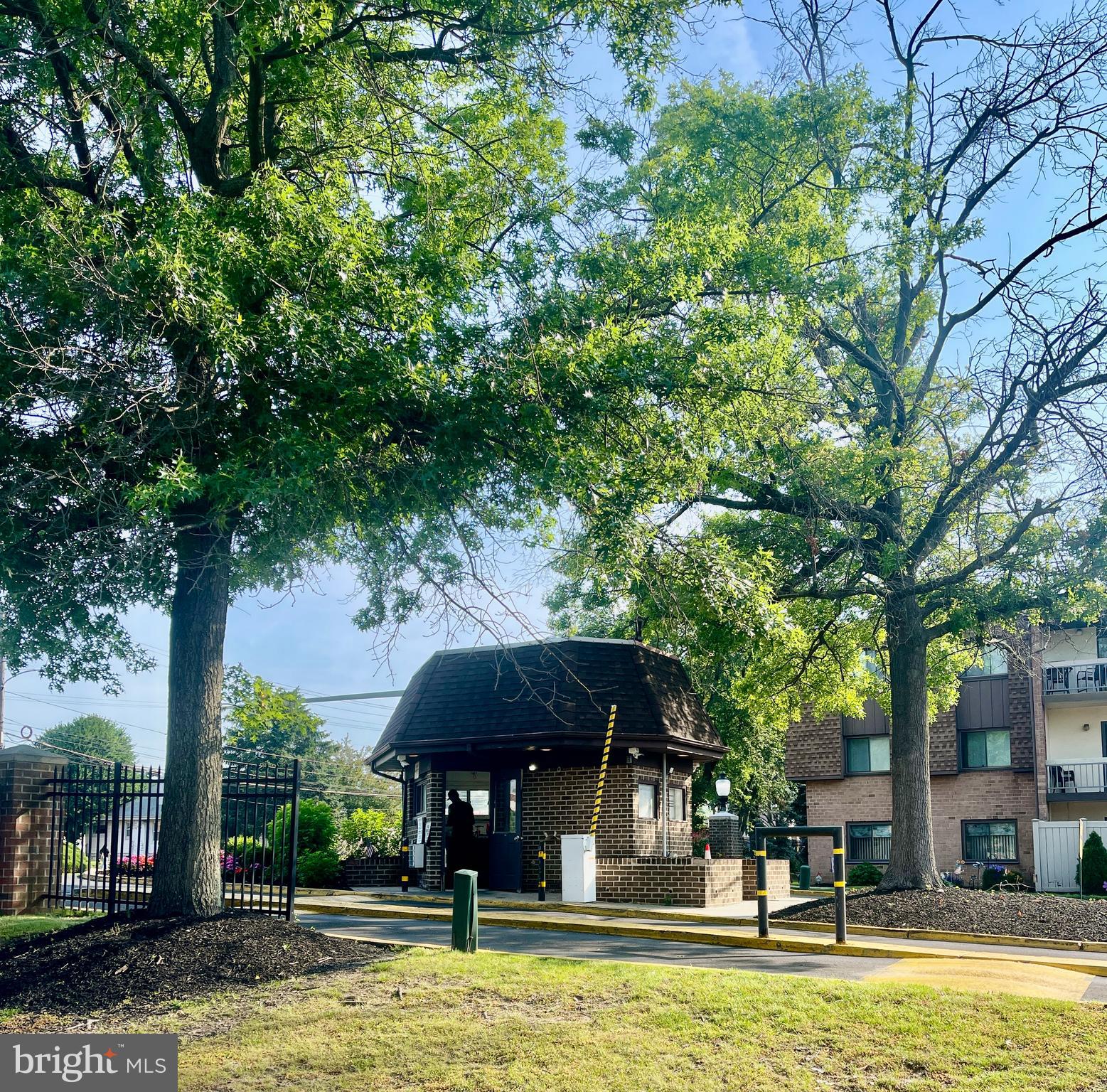 60201 Delaire Landing Road, Unit 201 Philadelphia, PA 19114 - Photo 43 of 49 a view of a swimming pool with a table and chairs under an umbrella