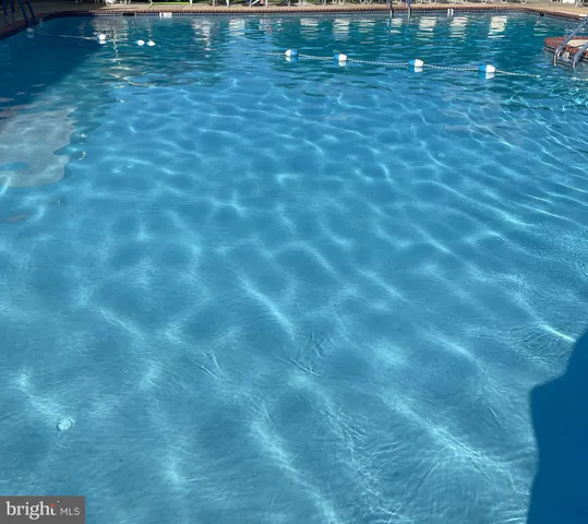 a view of yard with swimming pool