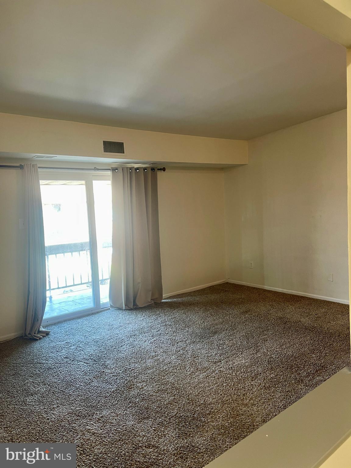 60201 Delaire Landing Road, Unit 201 Philadelphia, PA 19114 - Photo 6 of 49 an empty room with a empty space and windows