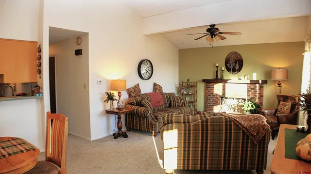 a bedroom with furniture and a window
