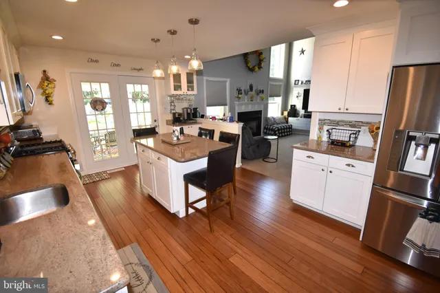a stove top oven sitting inside of a kitchen