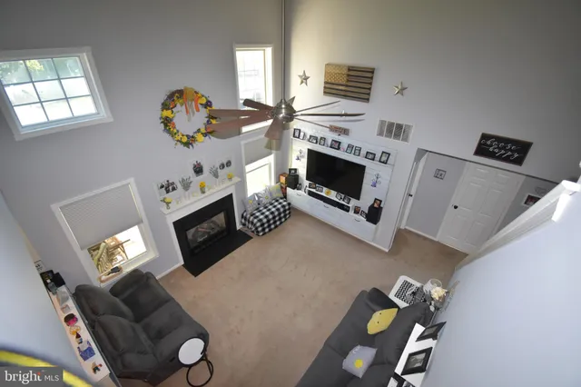 a bedroom with furniture and a large window