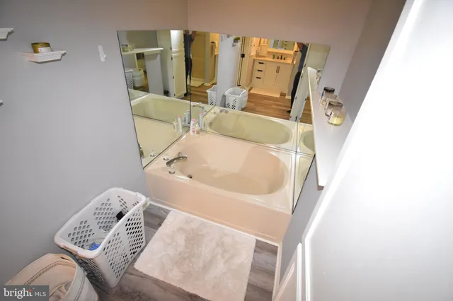 a bathroom with a sink a mirror and a toilet