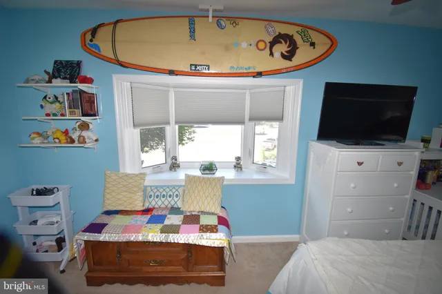 a bed room with a bed and a window