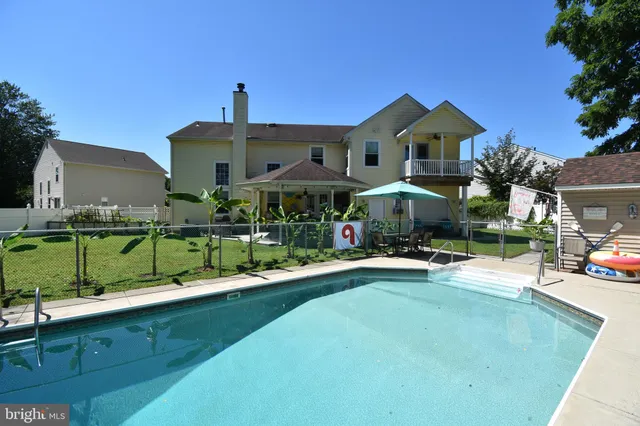 a view of a chairs and table in the patio