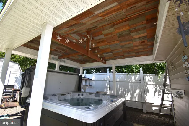 a view of outdoor kitchen with sink and outdoor