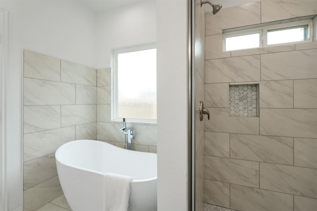 228 Windjammer Road Gun Barrel City, TX 75156 - Photo 14 of 19 a white bath tub sitting in a bathroom