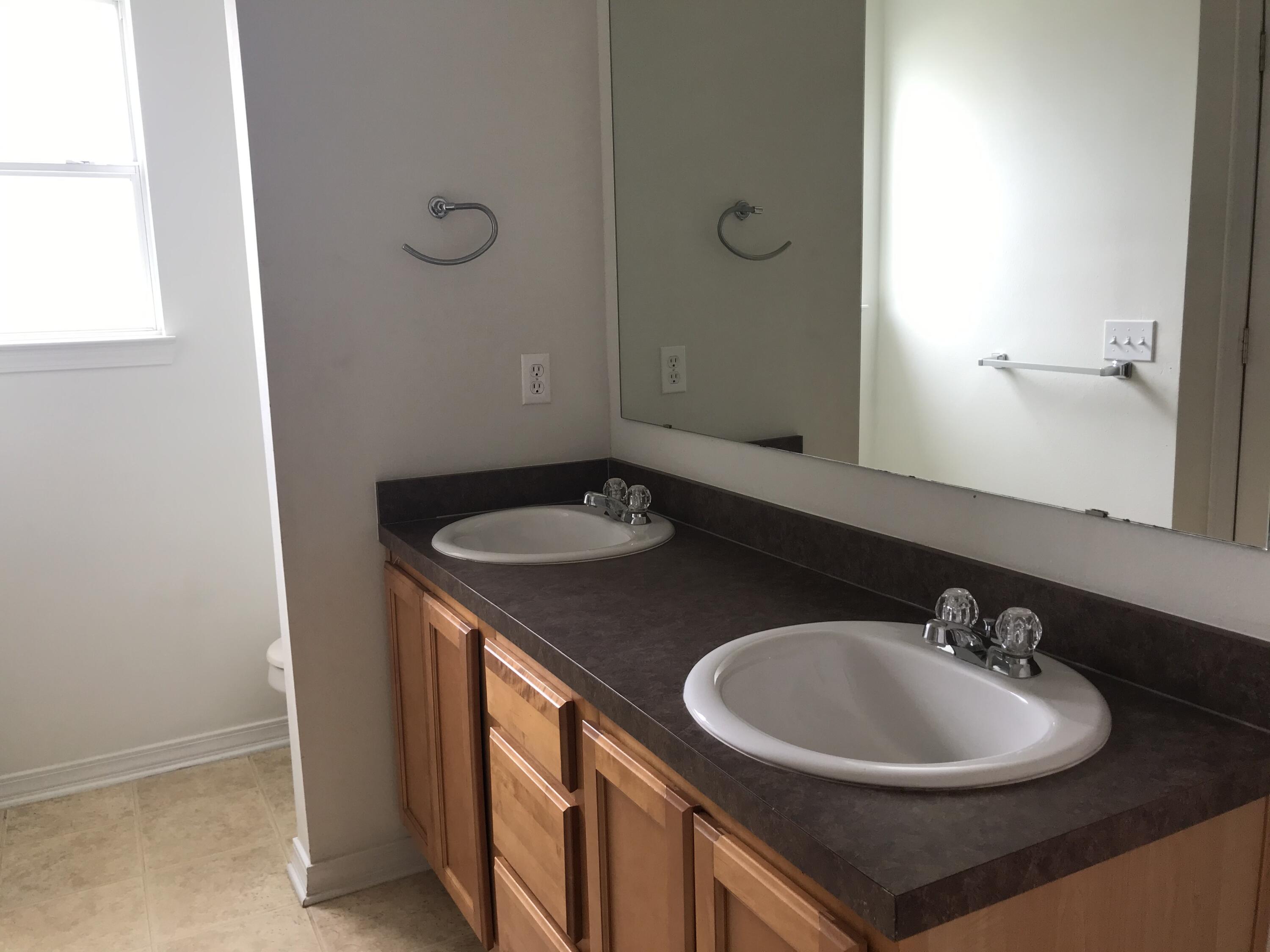294 Limestone Circle Crestview, FL 32539 - Photo 16 of 19 a bathroom with a sink and a mirror