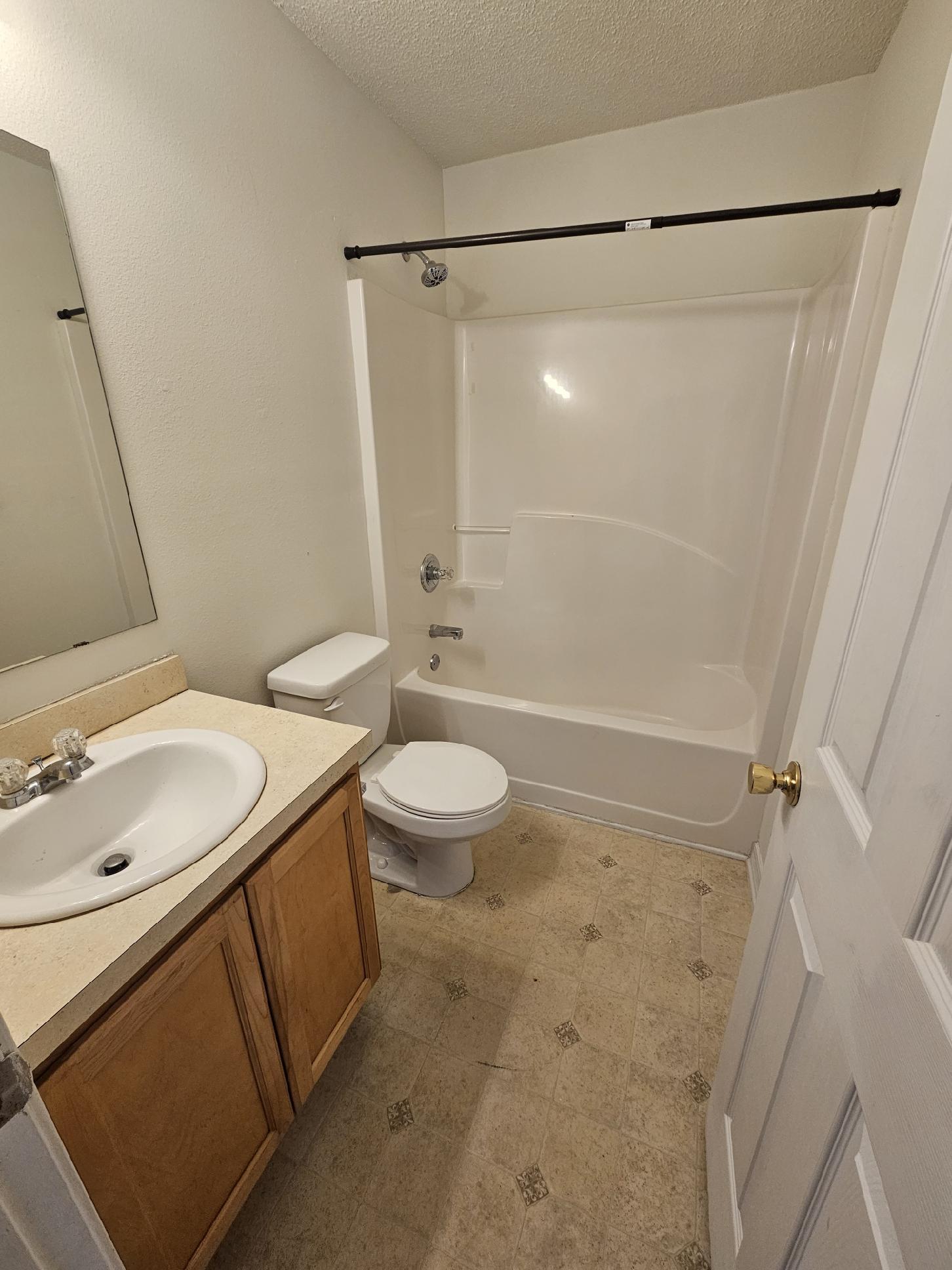 294 Limestone Circle Crestview, FL 32539 - Photo 19 of 19 a bathroom with a granite countertop sink toilet and shower