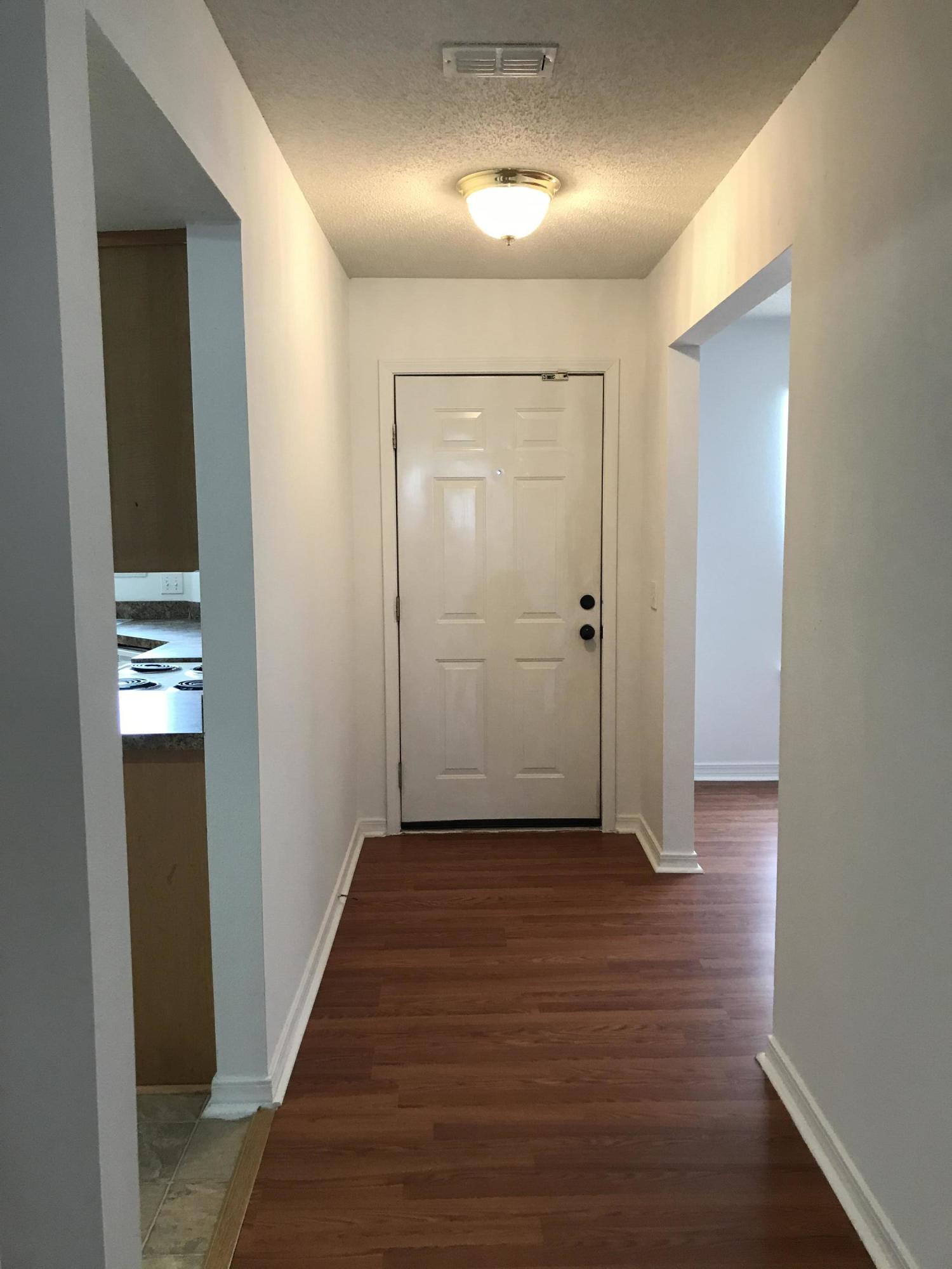 294 Limestone Circle Crestview, FL 32539 - Photo 3 of 19 wooden floor in a hall with an entryway