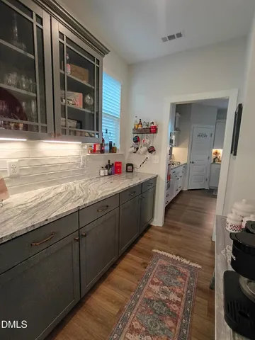 a kitchen with sink and cabinets