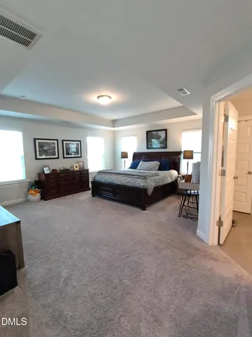 a living room with furniture window and a couch