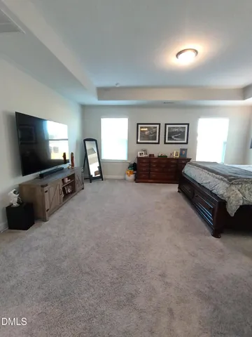 a bathroom with a granite countertop sink mirror and shower