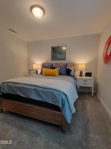 a bathroom with double vanity sink and a mirror