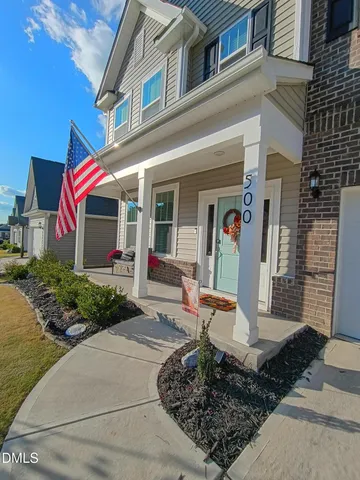 a front view of a house with a porch