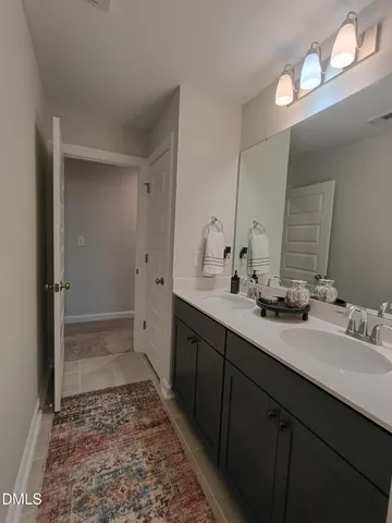 a living room with furniture and a air conditioner vent