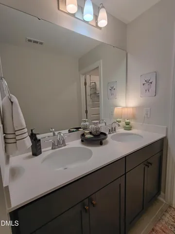 a living room with furniture rug and dining table