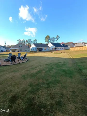 a view of a swimming pool with a yard