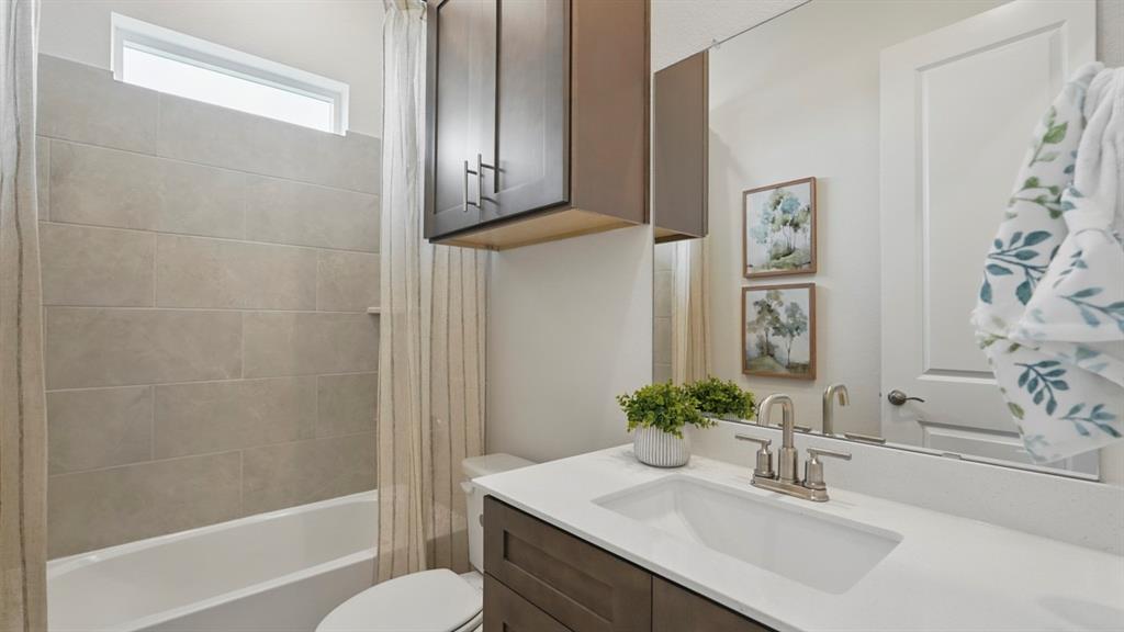 1016 Pitchfork Road Royse City, TX 75189 - Photo 20 of 35 a bathroom with a sink toilet and shower