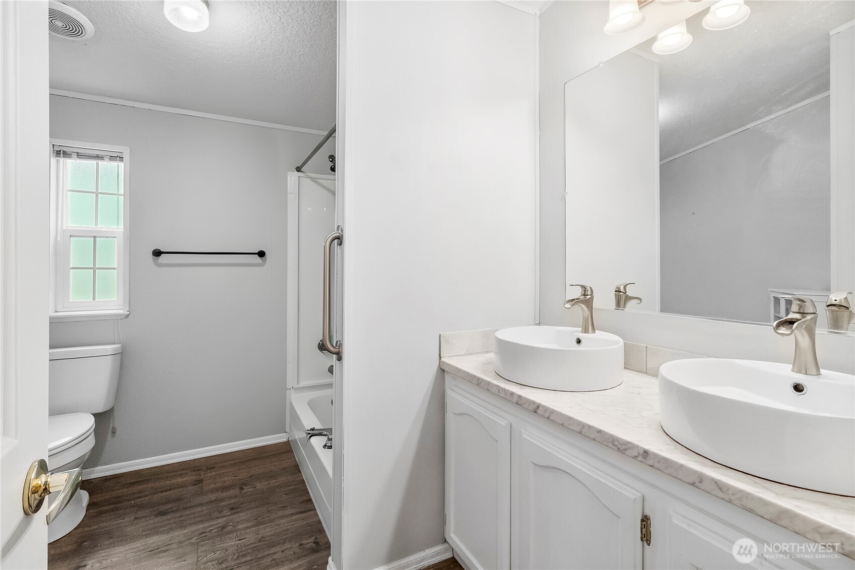 1200 Lincoln Street, Unit 193 Bellingham, WA 98229 - Photo 12 of 18 a bathroom with a sink toilet and shower