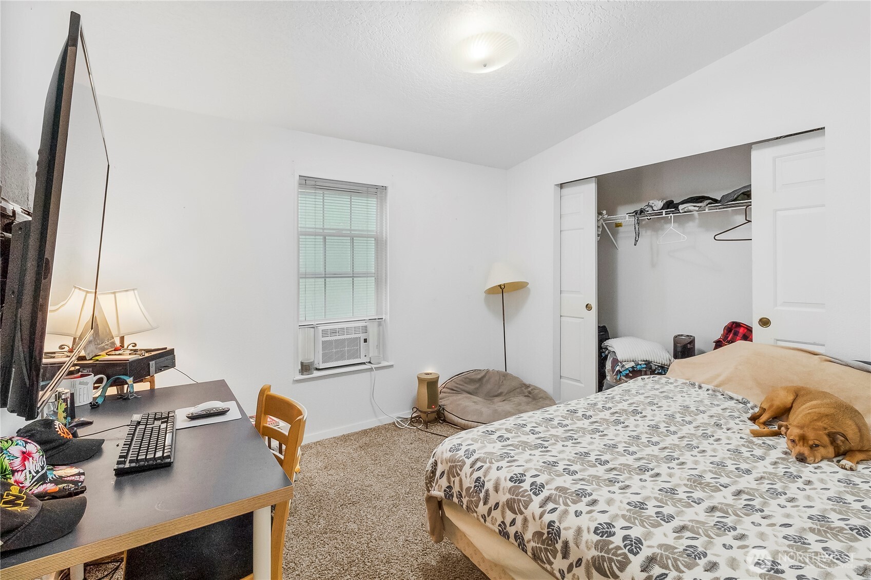 1200 Lincoln Street, Unit 193 Bellingham, WA 98229 - Photo 15 of 18 a bedroom with a bed and a table