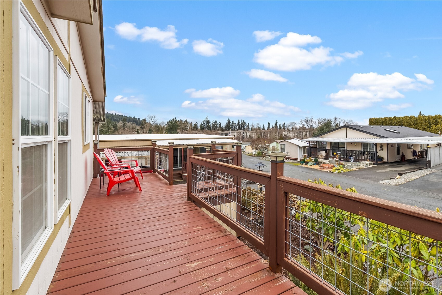 1200 Lincoln Street, Unit 193 Bellingham, WA 98229 - Photo 3 of 18 a view of a balcony with wooden chairs