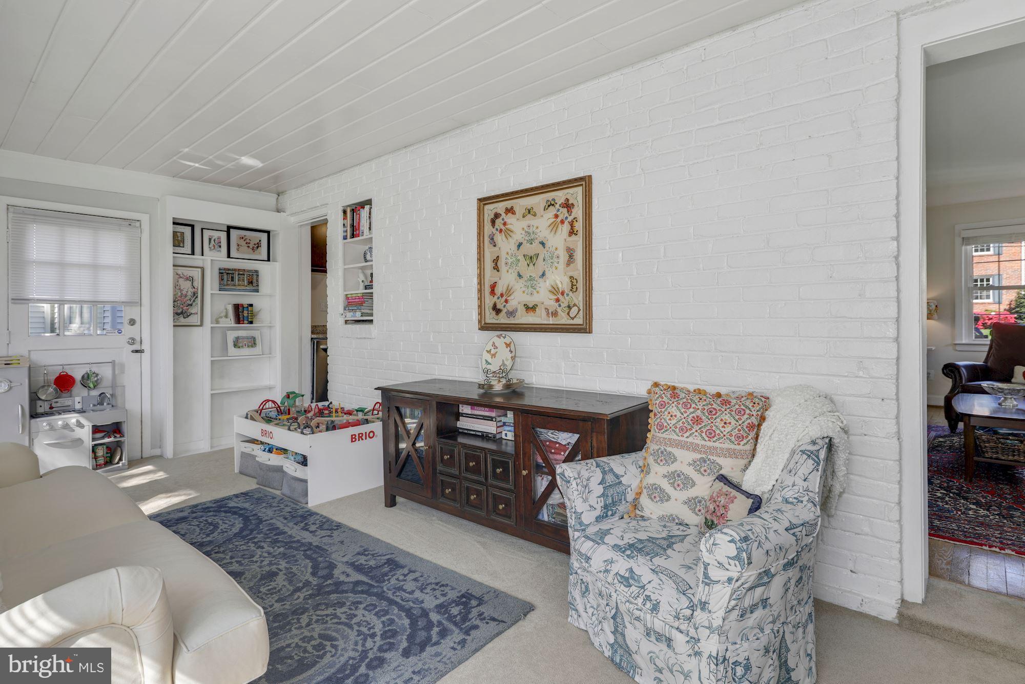 10008 Raynor Road Silver Spring, MD 20901 - Photo 12 of 24 with built-ins, a brick wall, and a door out