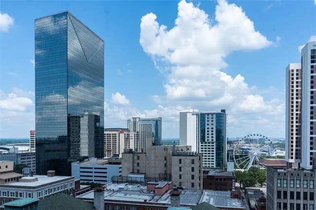 a view of a patio with couches chairs and table