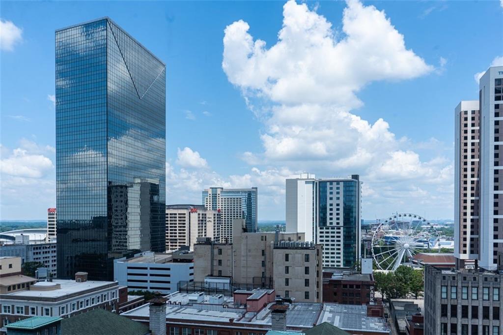 57 Forsyth Street Northwest, Unit 12B Atlanta, GA 30303 - Photo 34 of 38 a view of a patio with couches chairs and table
