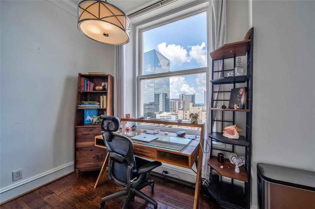 57 Forsyth Street Northwest, Unit 12B Atlanta, GA 30303 - Photo 8 of 38 a view of a dining room with furniture wooden floor and a window