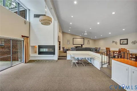 a view of a kitchen with furniture and a fireplace
