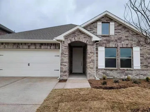 a front view of a house with a garage