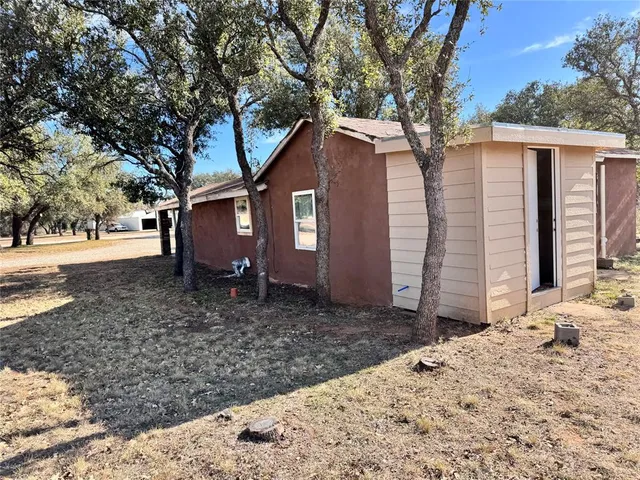 a view of outdoor space with playground and green space