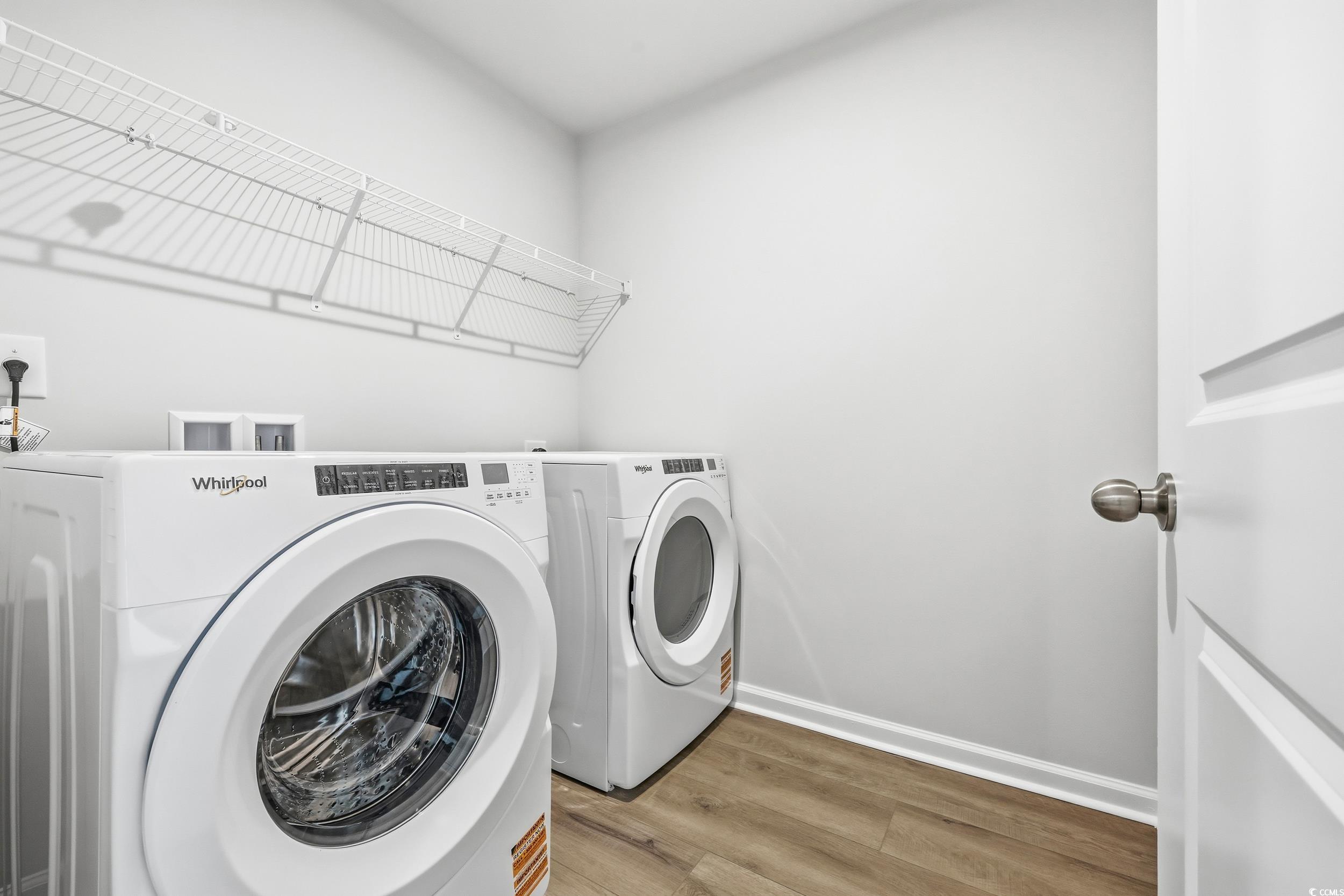 3055 Visionary Drive Myrtle Beach, SC 29588 - Photo 17 of 31 Laundry room featuring wood finished floors and washer and clothes dryer