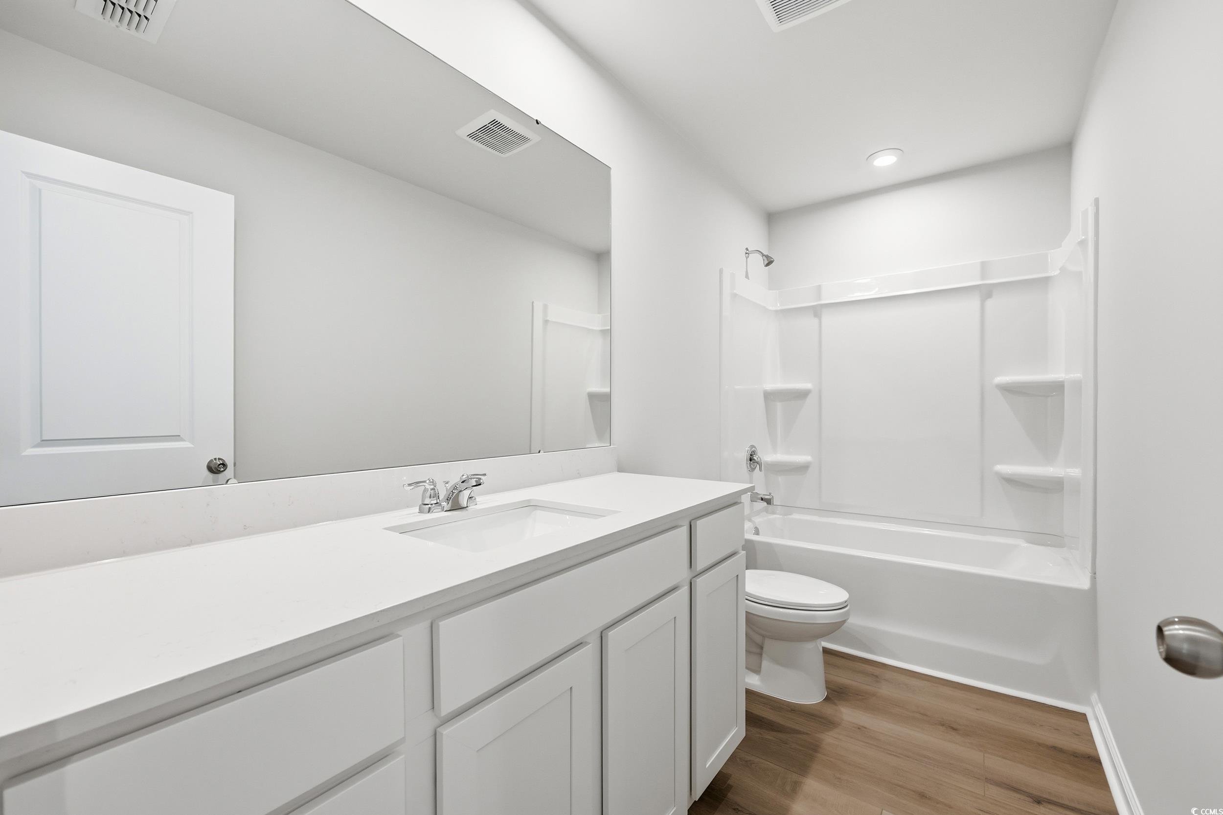 3055 Visionary Drive Myrtle Beach, SC 29588 - Photo 20 of 31 Full bathroom featuring vanity, tub / shower combination, and light wood-style flooring
